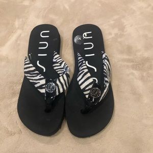 UNISA zebra patterned flip flops
